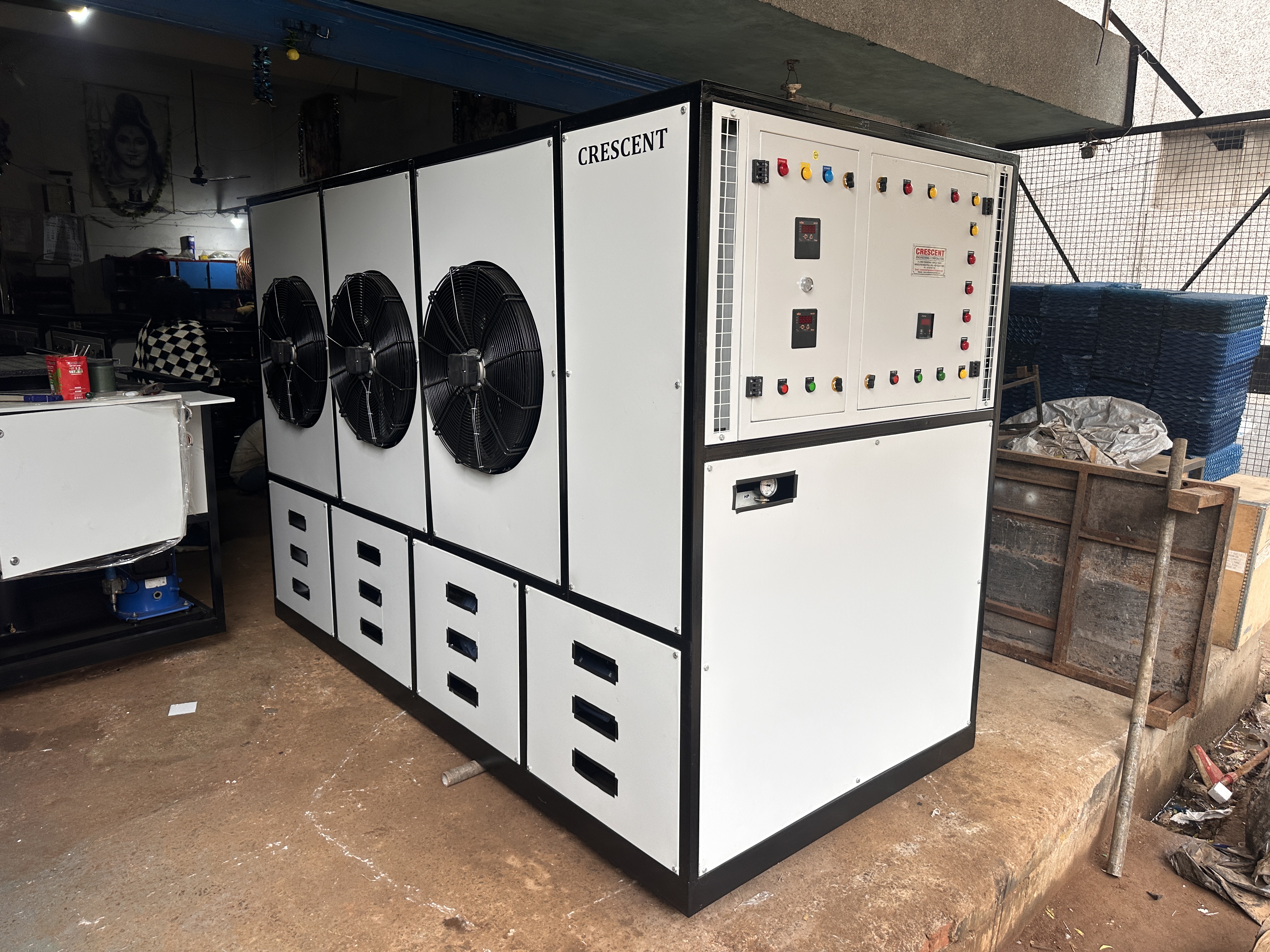 Large mesh-enclosed chiller unit on-site